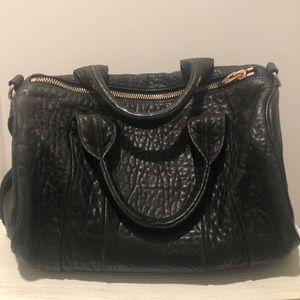 Alexander Wang Rocco Bag black pebbled leather with rose gold hardware.